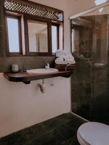 Ett badrum på Pousada Vento Sul - Arraial D'Ajuda