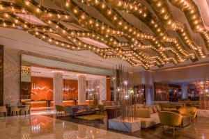 a hotel lobby with a large chandelier at Moon Palace The Grand Cancun All Inclusive in Cancún