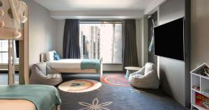Posteľ alebo postele v izbe v ubytovaní SkyCity Hotel Auckland