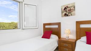 Postel nebo postele na pokoji v ubytování CB E-6 - Calella de Palafrugell + 15 fotografií