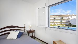A bed or beds in a room at CB N-2 - Calella de Palafrugell