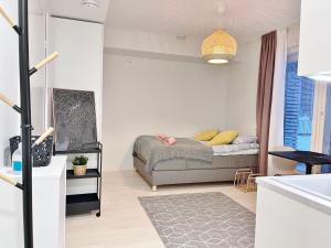Postel nebo postele na pokoji v ubytování Haalia Homes Turku Pääskynpesä