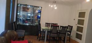 a dining room with a table and some chairs at 2 Bed semi-detached house in Poole
