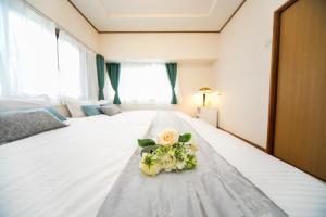 Ένα ή περισσότερα κρεβάτια σε δωμάτιο στο Awaji egaosakuie in Sumoto