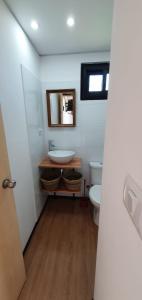 a bathroom with a sink and a toilet at FLORANVICk incluye 2 bicis!! in Colonia del Sacramento