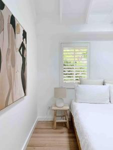 Säng eller sängar i ett rum på Casa Parker Stunning 3bdrm apartment in Killcare