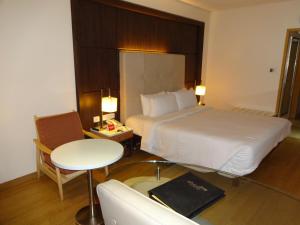 Postel nebo postele na pokoji v ubytování Savera Hotel