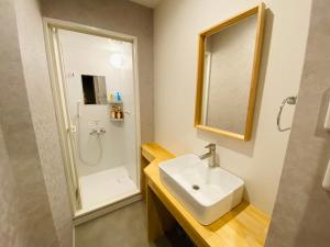 Ένα μπάνιο στο TABISAI HOTEL Suite 博多
