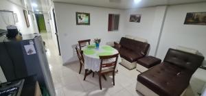 a kitchen and dining room with a table and chairs at Apartamento Ynj#2 in Bogotá