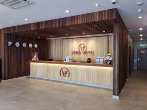 a view of a wine hotel lobby with a counter at VENO HOTEL in George Town