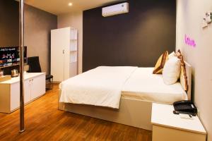 Postel nebo postele na pokoji v ubytování Bonita Grand Hotel