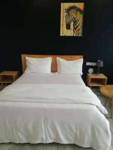 Postelja oz. postelje v sobi nastanitve Tanzanite Apartment（Tanzanite Park）