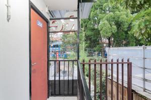 an entrance to a building with an open door at RedDoorz near Riau Junction Mall 2 in Bandung
