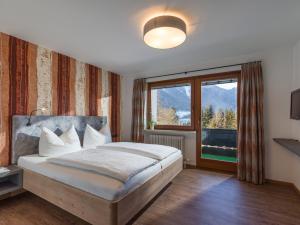 Postel nebo postele na pokoji v ubytování Appartements Rofangarten