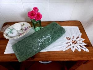 a table with a vase of flowers and a plate of food at La Rochelle in Wellington +20 photos