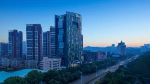 a view of a city with a tall building at Holiday Inn Express Yangjiang City Center, an IHG Hotel in Yangjiang