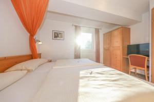 Posteľ alebo postele v izbe v ubytovaní Appartementhaus Chalet Alpina