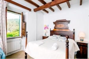 Łóżko lub łóżka w pokoju w obiekcie Casa Margarita bis, casa con pisicina en Fornalutx