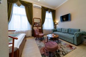 a living room with a couch and a table at Central Harmony Apartment in Odorheiu Secuiesc