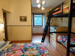 Postel nebo postele na pokoji v ubytování B&B Il Ghiro-Country House