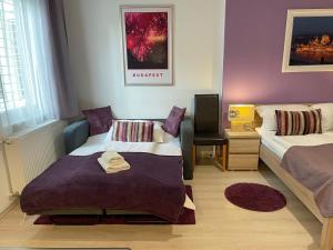 A bed or beds in a room at ABT Apartments Karoly
