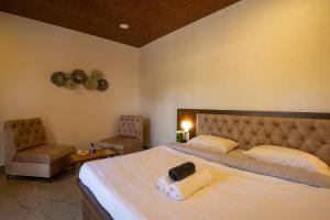 Posteľ alebo postele v izbe v ubytovaní Takshshila Park And Resorts