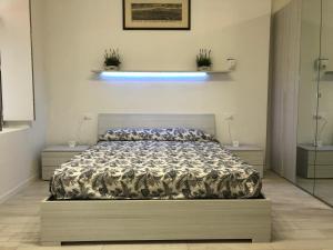 Łóżko lub łóżka w pokoju w obiekcie Appartamento House Apartment Tabe Centro Bologna