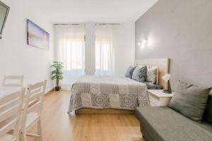 Ένα ή περισσότερα κρεβάτια σε δωμάτιο στο Apartament Hispalis Triana