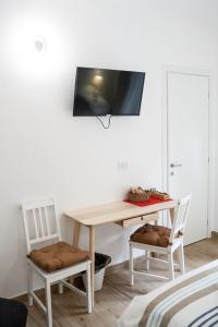 Μια τηλεόραση ή/και κέντρο ψυχαγωγίας στο B&B Alighieri 97