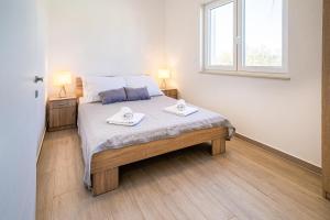 Voodi või voodid majutusasutuse Villa Smile toas +21 fotot