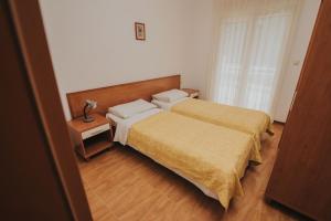 Villa Malo More tesisinde bir odada yatak veya yataklar