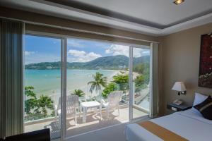 a hotel room with a view of the ocean at The Front Hotel and Apartments in Patong Beach