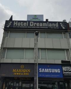 a hotel dreamland sign on top of a building at Hotel Dreamland Chandigarh in Chandīgarh