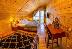 Postel nebo postele na pokoji v ubytování Hutor Hotel