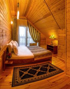Postel nebo postele na pokoji v ubytování Hutor Hotel