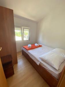 Postel nebo postele na pokoji v ubytování Apartmani Marija