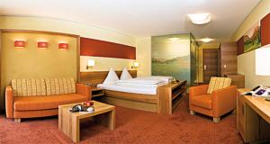 Voodi või voodid majutusasutuse Hotel Tyrol am Haldensee toas