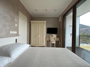 Posteľ alebo postele v izbe v ubytovaní VILLA COLLINA VERDE