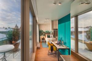 a home office with a view of a balcony at Cortile Hotel - Adults Only in Budapest