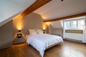 Llit o llits en una habitació de Charming House in Le Sablon
