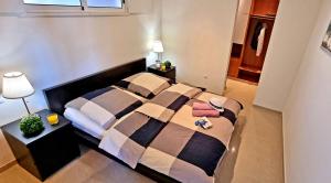 A bed or beds in a room at Ferienwohnung LILLY - Costa Calma - Pool - Meerblick