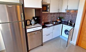 A kitchen or kitchenette at Ferienwohnung LILLY - Costa Calma - Pool - Meerblick
