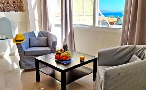 A seating area at Ferienwohnung LILLY - Costa Calma - Pool - Meerblick