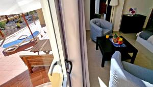 A seating area at Ferienwohnung LILLY - Costa Calma - Pool - Meerblick