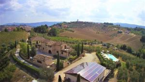 an aerial view of a house with a solar roof at Agriturismo alla Solagna in Colli del Tronto