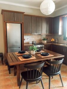 A kitchen or kitchenette at Agrilia Maison