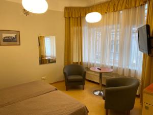TV a/nebo společenská místnost v ubytování Hommiku Guesthouse