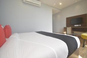 Voodi või voodid majutusasutuse Ka10 SQUARE HOTEL & BANQUETS toas