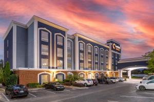 a rendering of a hotel with cars parked in a parking lot at Comfort Suites Olive Branch - Memphis South in Olive Branch