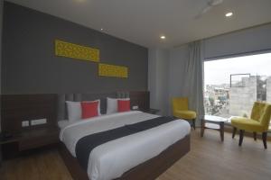 Voodi või voodid majutusasutuse Ka10 SQUARE HOTEL & BANQUETS toas